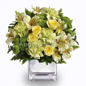 Composition of yellow flowers in glass vase