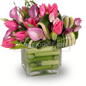 Composition in glass vase with pink flowers