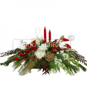 Christmas centerpiece with candles and berries